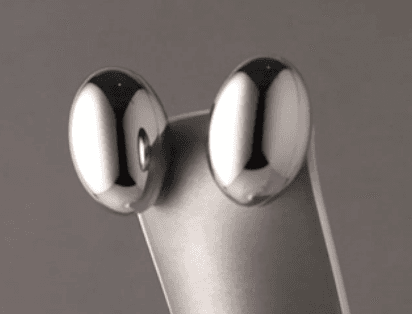 Macro photo, the new device's smooth probe heads, from the 2026 box